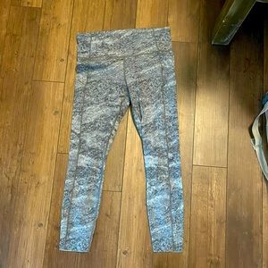 Grey Lululemon tights with reflective detail